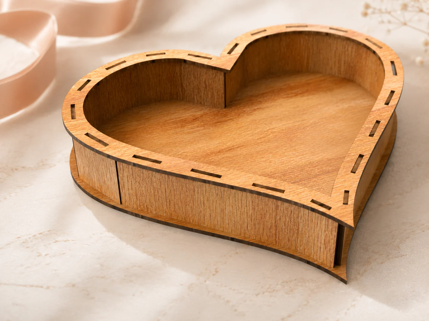 Close-up of Classic Heart Box laser cut file showing wood grain, laser-cut slots, burnt edges, curved side panels, and 5 cm box depth