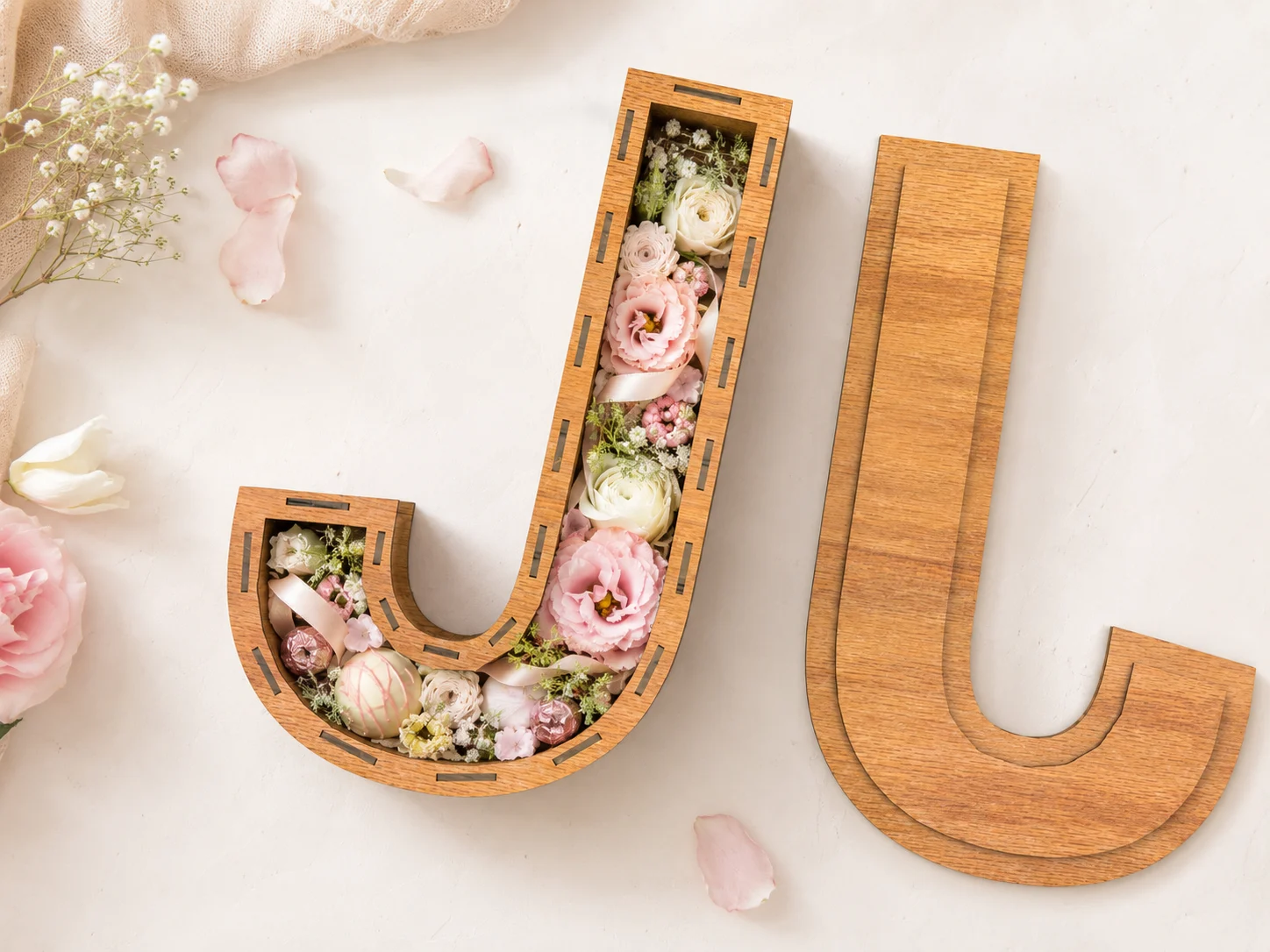 Top view of fillable Letter J wooden box with removable lid, decorated with pastel flowers, ribbon, and petals, SVG DXF CDR laser cut file